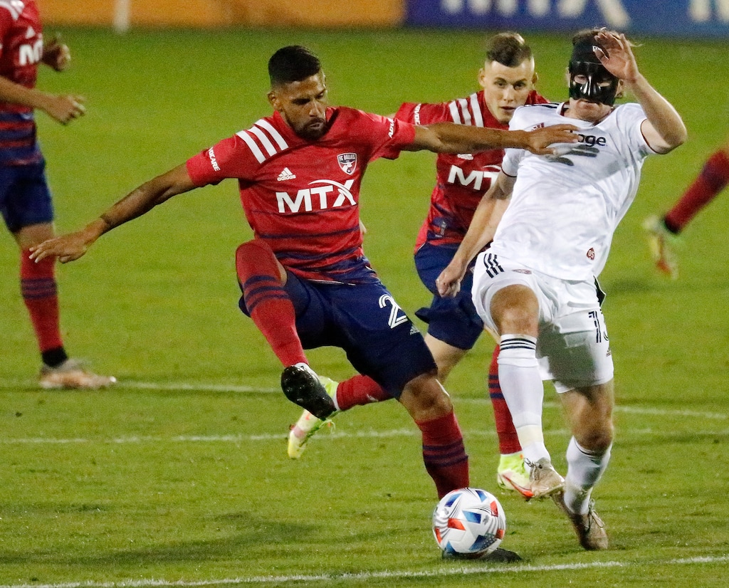 (Stewart F. House | The Dallas Morning News via AP) FC Dallas forward Franco Jara (29) and Real Salt Lake midfielder Nick Besler (13) battle for the ball during the first half of an MLS soccer game, Wednesday, Oct. 27, 2021 in Frisco, Texas.
