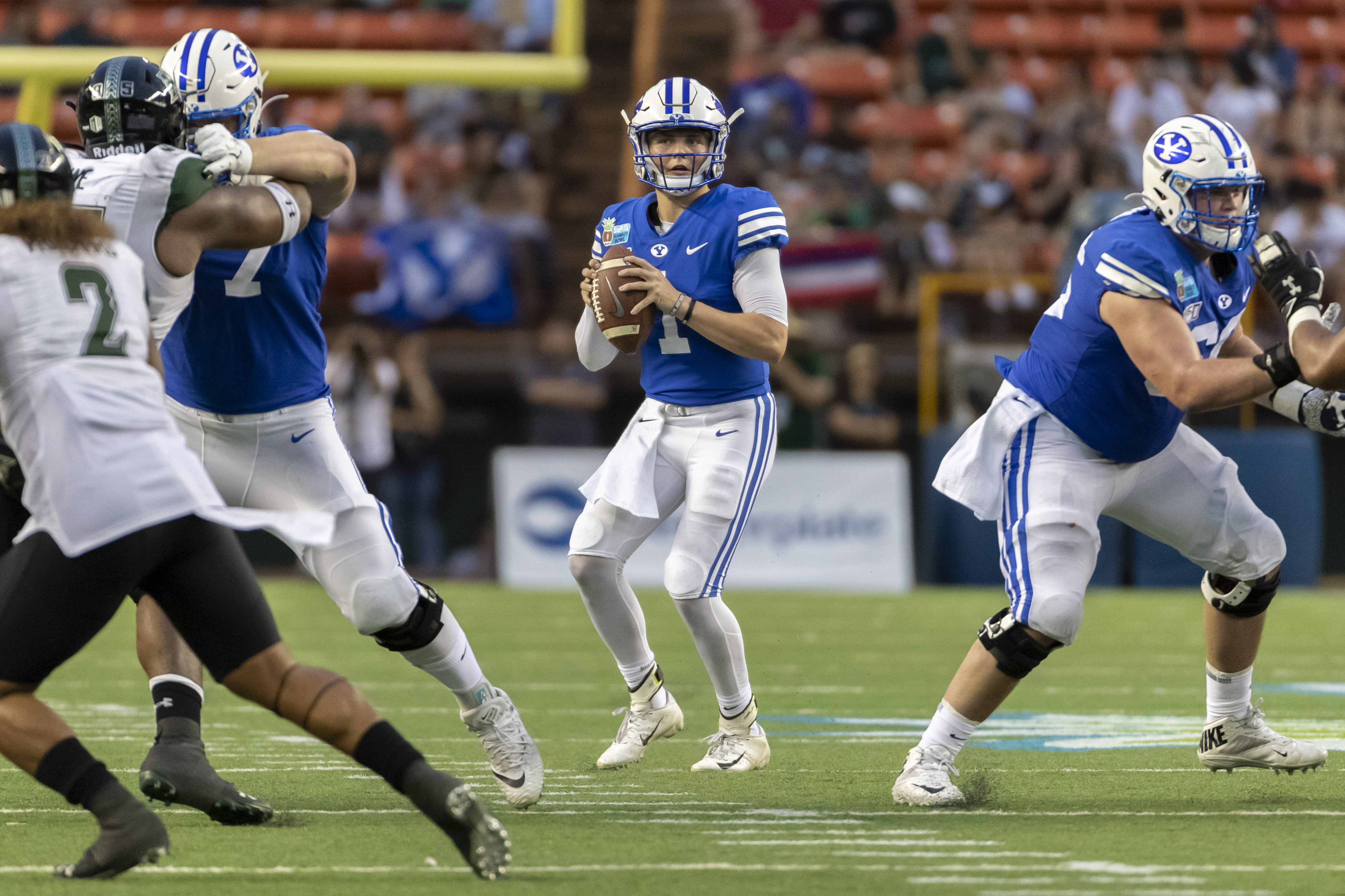BYU quarterback Zach Wilson (1) drops back to pass during the second half of the team's Hawaii Bowl NCAA college football game against Hawaii, Tuesday, Dec. 24, 2019, in Honolulu. (AP Photo/Eugene Tanner)