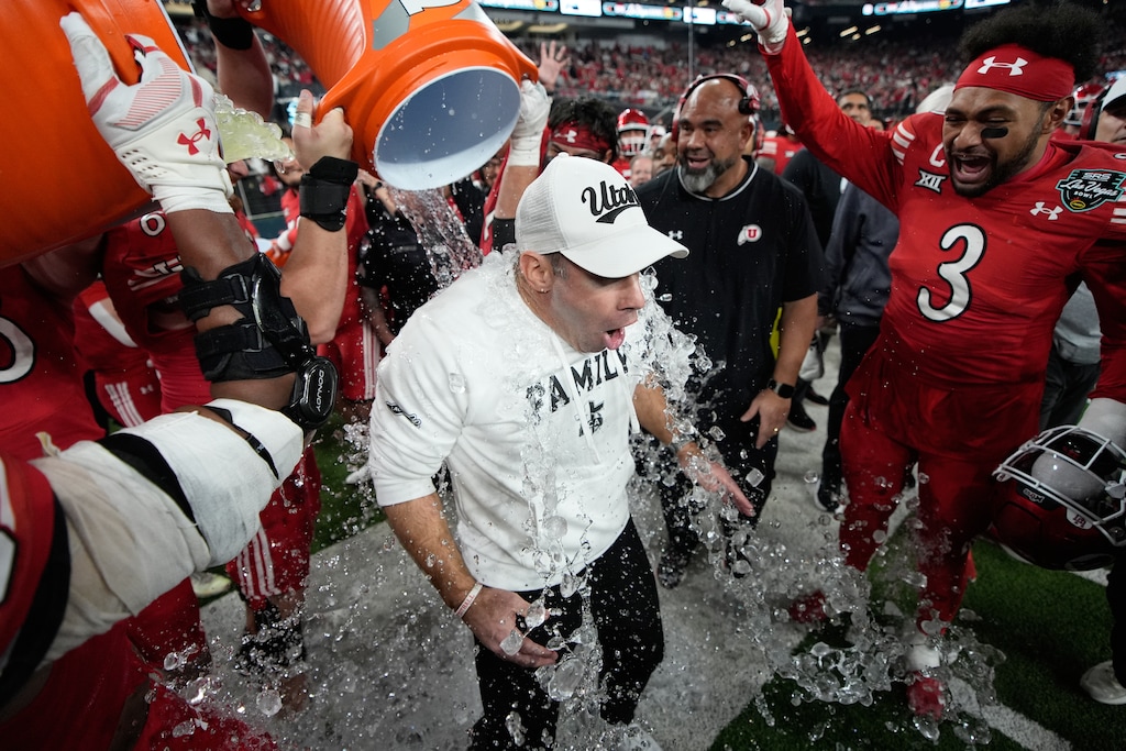 (John Locher | AP) Players dump water and Gatorade on Utah head coach Morgan Scalley after defeating Nebraska in the Las Vegas Bowl, Wednesday, Dec. 31, 2025, in Las Vegas.