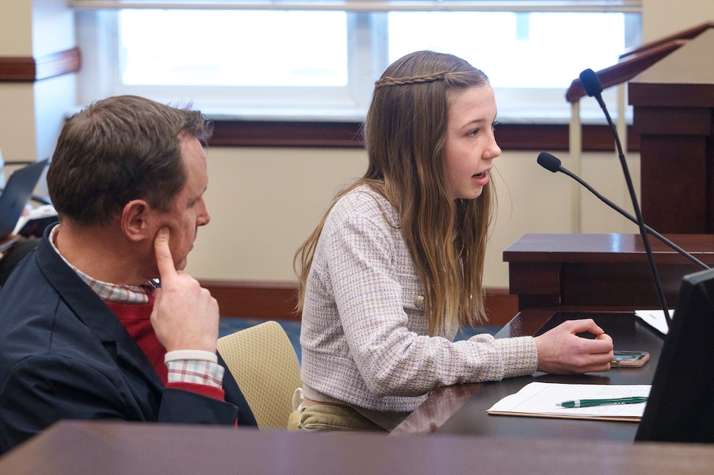 (Leah Hogsten | The Salt Lake Tribune)  Lucy Loewen, 13, speaks against SB152, right, while Ben Horsley, communications and community outreach director for Granite School District, left, spoke in favor of the bill, Jan. 31, 2023, during the comment period for Sen. Michael McKell, R-Spanish Fork's bill before the Senate Business and Labor Committee in the Senate Building, Tuesday. The bill was passed out of the committee favorably.