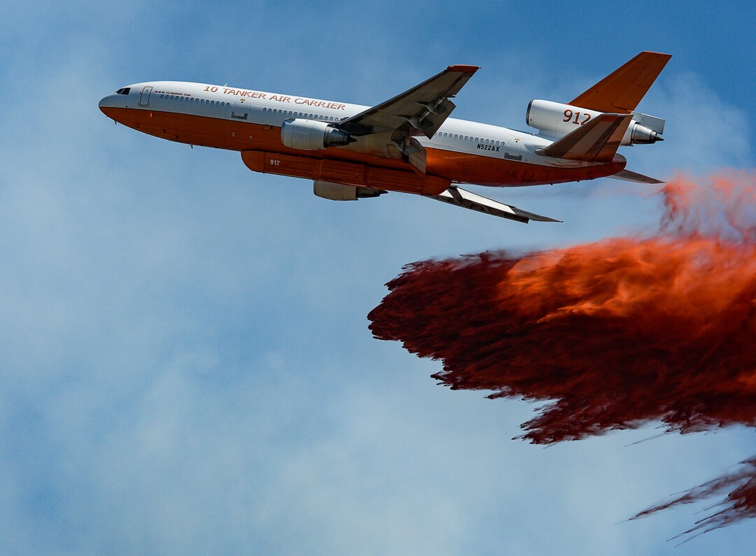 (Francisco Kjolseth  |  The Salt Lake Tribune)  Fire Crews direct a slurry bomber to unload its payload along the East Bountiful bench that grew to 150 acres early Friday morning, Aug. 30, 2019, and destroyed three homes.  On Sept. 2, officials said the fire was 100% contained.