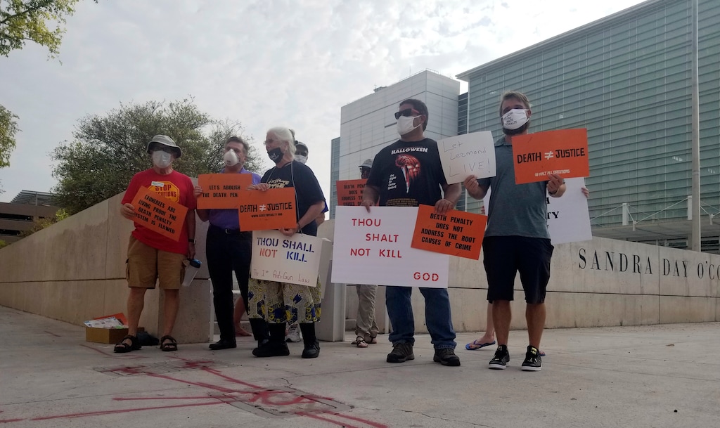 (Terry Tang | AP) Members of Death Penalty Alternatives for Arizona demonstrate against the scheduled execution of the only Native American on federal death row, Tuesday, Aug. 25, 2020, outside the Sandra Day O'Connor Federal Courthouse in Phoenix. Lezmond Mitchell, who was tried at that courthouse, is set to die Wednesday for the 2001 slayings of a 9-year-old and her grandmother nearly two decades ago on the Navajo Nation, though many Navajos are hoping for last-minute intervention by President Donald Trump to halt the execution.