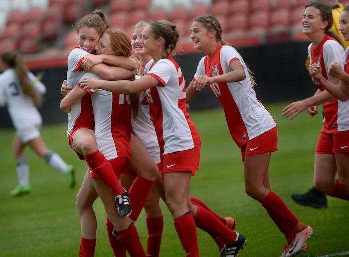 (Scott Sommerdorf   |  The Salt Lake Tribune)   American Fork's Jamie Shepherd, left, jumped into the arms of team mate Rachel McCarthy after Shepherd's goal gave the Cavemen a 2-1 lead. American Fork beat Syracuse 3-1 to win the 6A championship game played at Rio Tinto, Friday, October 20, 2017. 