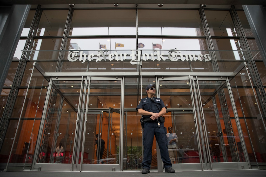 A police officer stands guard outside The New York Times building, Thursday, June 28, 2018, in New York. (AP Photo/Mary Altaffer)