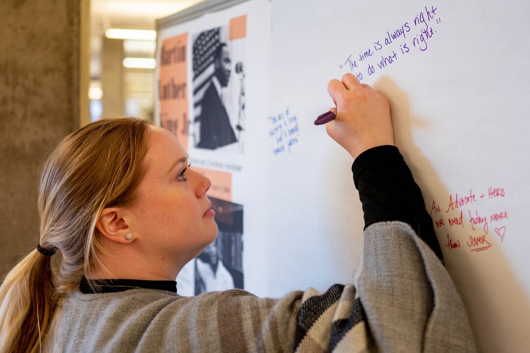 (Trent Nelson  |  The Salt Lake Tribune) Jen Wilson writes a quote on an interactive exhibit highlighting six figures in African American history at the University of Utah's Eccles Health Sciences Library in Salt Lake City on Thursday, Feb. 20, 2020.