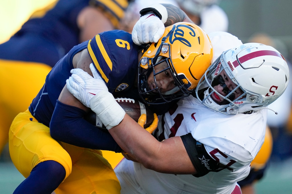 (Godofredo A. Vásquez | AP) Stanford defensive lineman Jaxson Moi tackles California running back Jaydn Ott (6) during the first half of an NCAA college football game in Berkeley, Calif., Saturday, Nov. 19, 2022. The Atlantic Coast Conference has cleared the way for Stanford, California and SMU to join the league, two people with direct knowledge of the decision told The Associated Press on Friday, Sept. 1, 2023, providing a landing spot for two more teams from the disintegrating Pac-12.