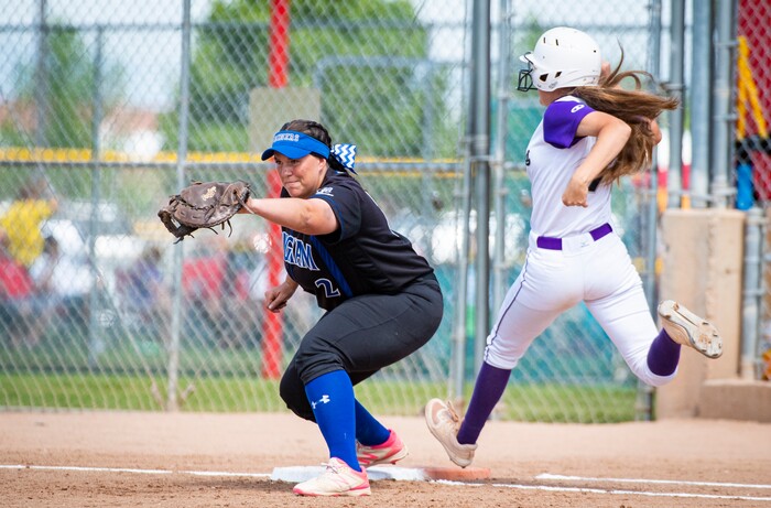 (Isaac Hale | Special to The Tribune) Bingham's Emily Dority (2) makes a catch at first base to out Riverton catcher Mariyah Delgado (7) during the second game of a best-of-three series between the Bingham Miners and the Riverton Silverwolves as part of the 6A state softball championship held at the Spanish Fork Sports Park on Friday, May 28, 2021.