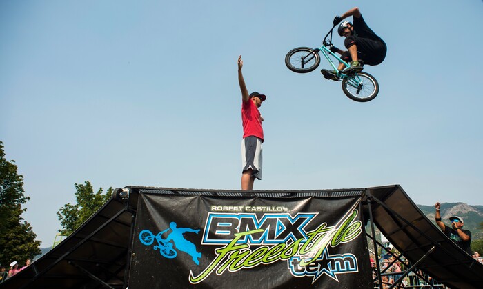 (Rick Egan  |  The Salt Lake Tribune)    Justin McCarty jumps over Marc Snell of Layton, during the BMX Stunt Show, at the Davis County Fair in Farmington, Saturday, Aug. 18, 2018.