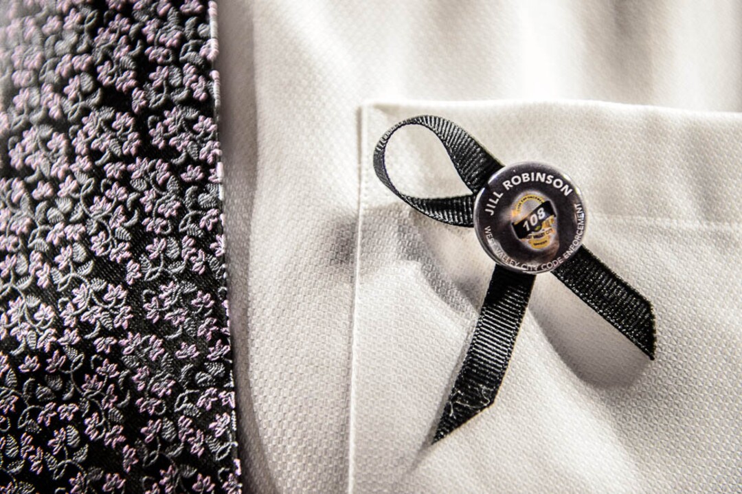 (Trent Nelson | The Salt Lake Tribune)  A ribbon at funeral services for Jill Robinson, a West Valley City code-enforcement officer killed on the job last week. The service took place at the Maverik Center in West Valley City on Friday Aug. 17, 2018.