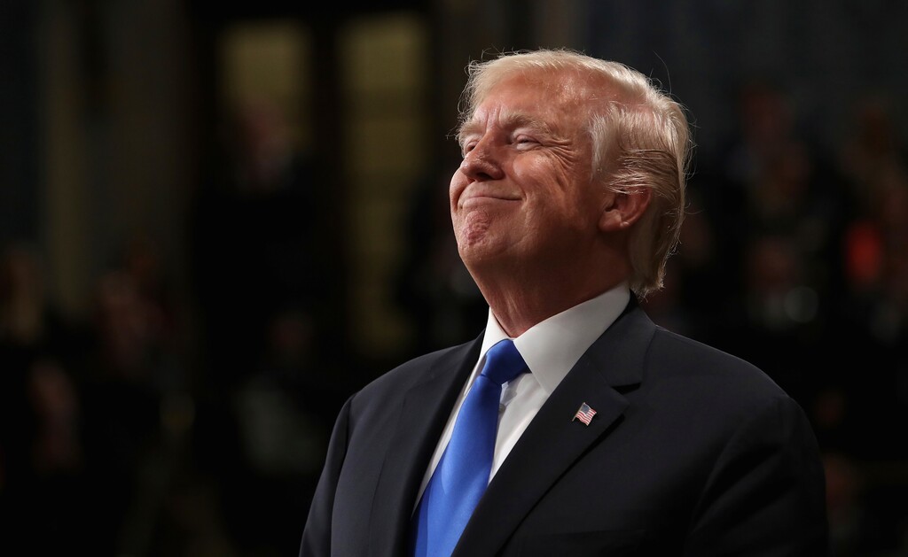 President Donald Trump smiles during State of the Union address in the House chamber of the U.S. Capitol to a joint session of Congress Tuesday, Jan. 30, 2018 in Washington. (Win McNamee/Pool via AP)