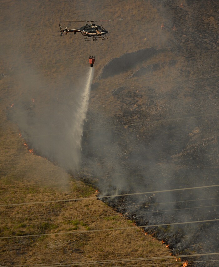 (Francisco Kjolseth  |  The Salt Lake Tribune)  Crews battle a grass fire in Tooele county being dubbed the Green Ravine fire as it burns on Tuesday, Sept. 3, 2019.