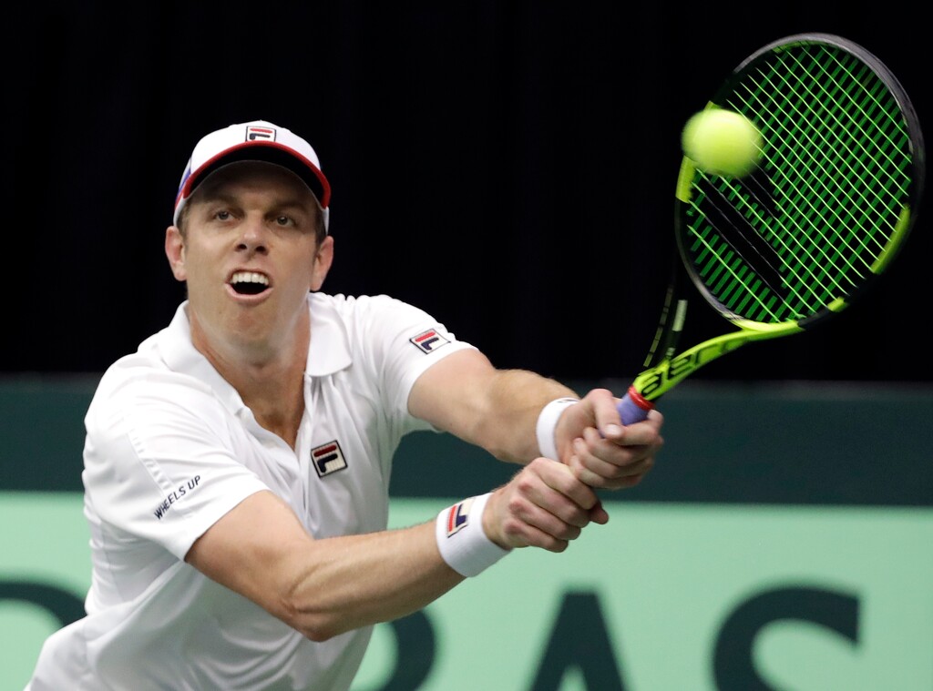 Sam Querrey, of the United States, returns a shot to Ruben Bemelmans, of Belgium, during a Davis Cup quarterfinal singles tennis match Friday, April 6, 2018, in Nashville, Tenn. (AP Photo/Mark Humphrey)
