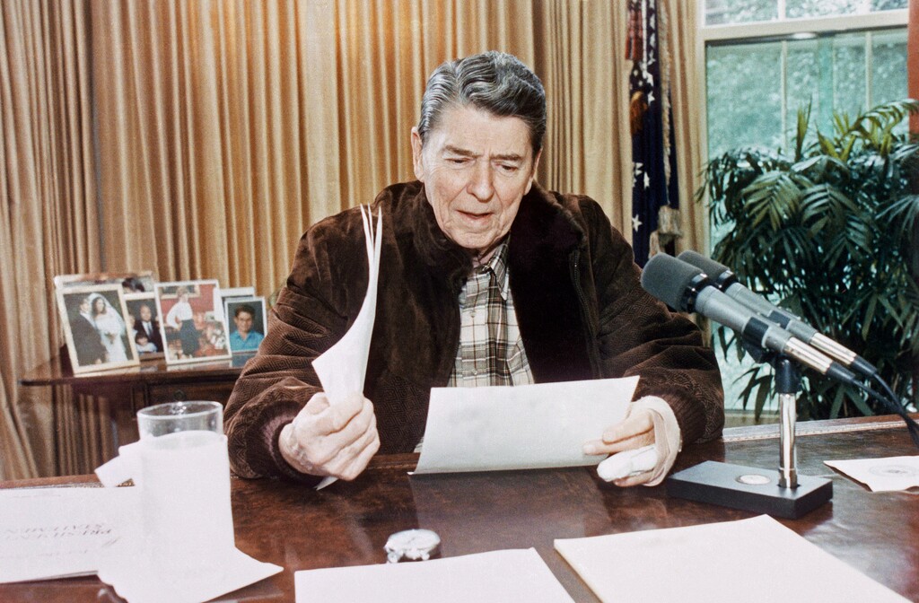 (Susan Biddle | White House via AP file photo)  President Ronald Reagan gives his final radio speech to the nation from the Oval Office in Washington on Jan. 14, 1989.