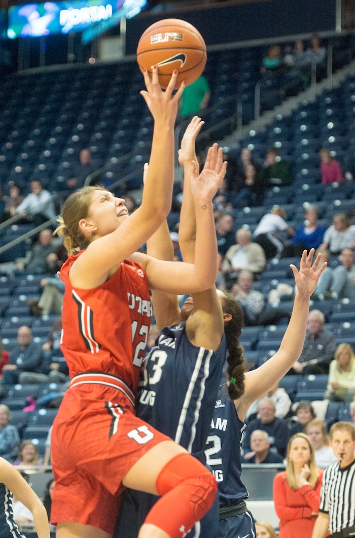 Rick Egan  |  The Salt Lake Tribune

Utah Utes forward Emily Potter (12) takes the ball up for a shot, as Brigham Young  forward Jasmine Moody (33) defends for the Cougars, in basketball action, BYU vs. The University of Utah,  in the Marriott Center, Saturday, December 12, 2015. 