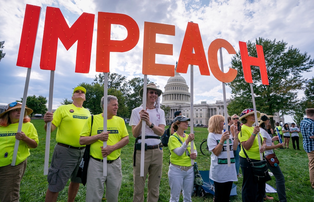 (J. Scott Applewhite | AP file photo) Activists rally for the impeachment of President Donald Trump, at the Capitol in Washington, Thursday, Sept. 26, 2019. Speaker of the House Nancy Pelosi, D-Calif., committed Tuesday, Sept, 24, 2019, to launching a formal impeachment inquiry against Trump.