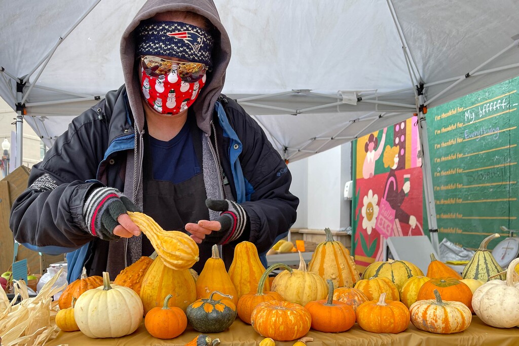 (Trent Nelson | The Salt Lake Tribune) Trina Hasty works the Parker Farms booth at Salt Lake City's Winter Market at The Gateway on Saturday, Nov. 14, 2020.