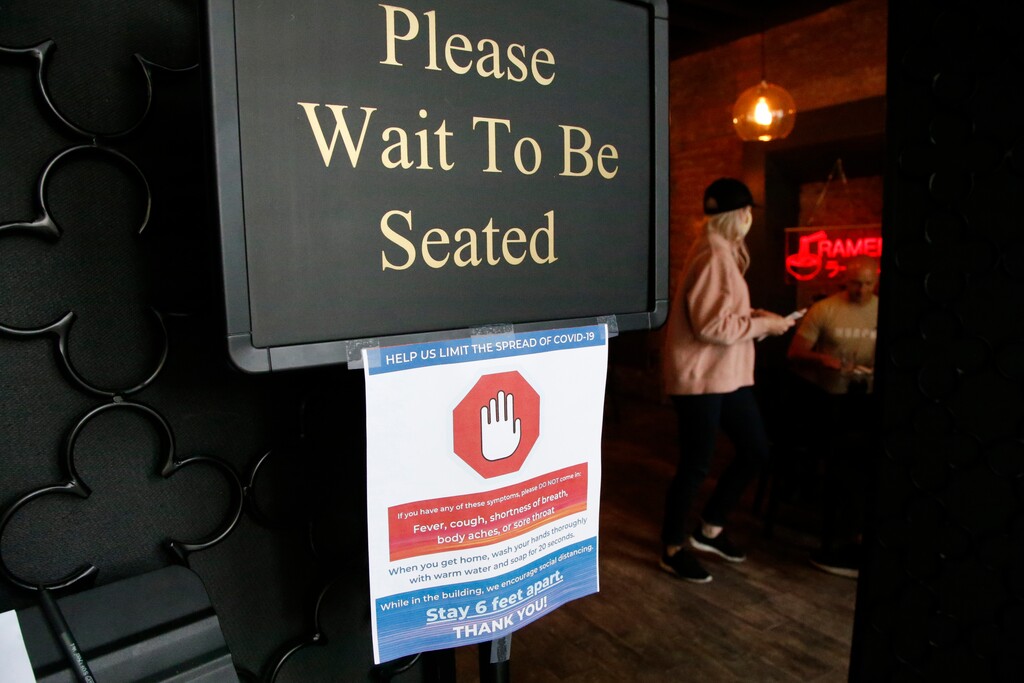 (Rick Bowmer | AP file photo) A social distancing guideline sign at Salt Lake City's Ramen Bar in May.