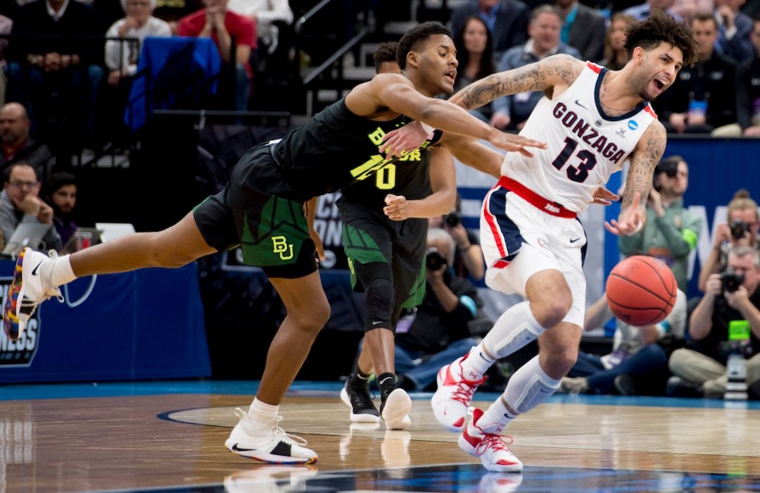 (Leah Hogsten  | The Salt Lake Tribune)  Gonzaga Bulldogs guard Josh Perkins (13) is fouled by Baylor Bears guard Jared Butler (12) as Baylor faces Gonzaga in the second round of the NCAA tournament in Salt Lake City on Saturday, March 23, 2019.