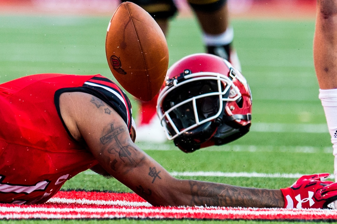 (Chris Detrick  |  The Salt Lake Tribune)  Utah Utes wide receiver Raelon Singleton (11) looses his helmet after being tackled during the game at Rice-Eccles Stadium Thursday, August 31, 2017. Utah Utes are leading North Dakota Fighting Hawks 17-9 at halftime. 