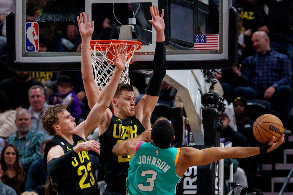 (Trent Nelson | The Salt Lake Tribune) Utah Jazz forward Lauri Markkanen (23) and Utah Jazz center Walker Kessler (24) defending San Antonio Spurs forward Keldon Johnson (3) as the Utah Jazz host the San Antonio Spurs, NBA basketball in Salt Lake City on Saturday, Feb. 25, 2023.