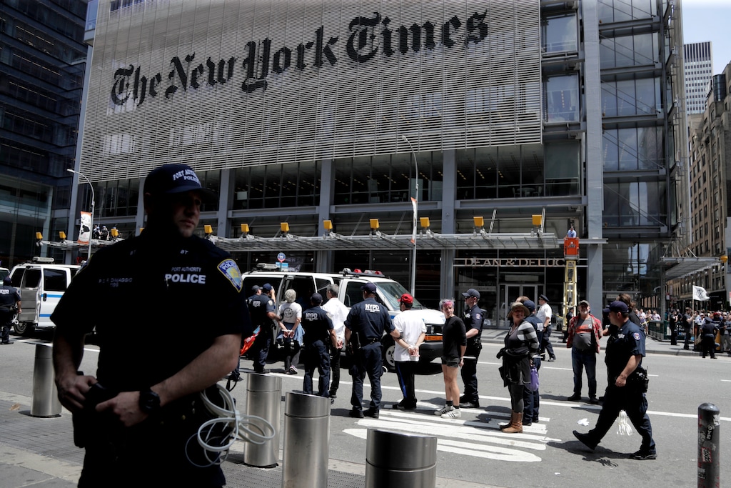 (Julio Cortez | AP photo)

New York Police officers take into custody activists during a climate change rally outside of the New York Times building, Saturday, June 22, 2019, in New York.