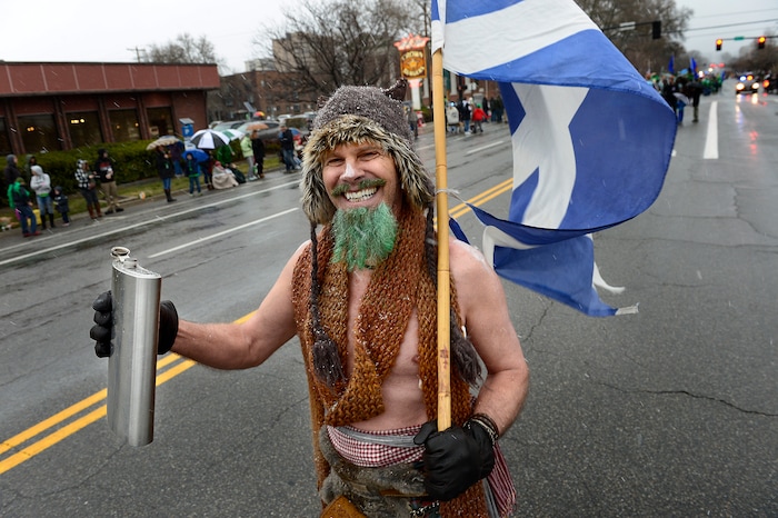 (Scott Sommerdorf | The Salt Lake Tribune) A member of the Utah Scottish Festival and Highland Games group marches during the 40th annual Salt Lake City St. Patrick's Day Parade on Saturday, March 17, 2018.