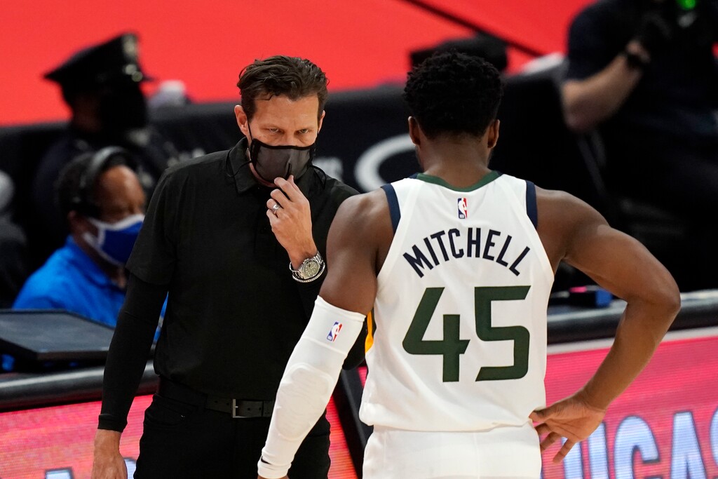 (Carlos Osorio | AP) Utah Jazz guard Donovan Mitchell (45) goes to the sideline to talk with head coach Quin Snyder during the second half of an NBA basketball game against the Detroit Pistons, Sunday, Jan. 10, 2021, in Detroit.