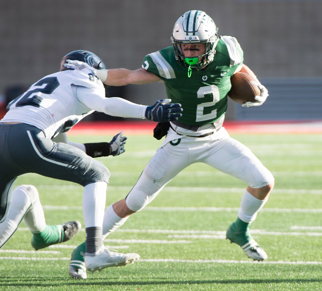 (Rick Egan  |  The Salt Lake Tribune)    Olympus running back Tommy Poulton (2), runs the ball for the Titans, in 5A football semifinal action between Olympus and Corner Canyon at Rice-Eccles Stadium, Thursday, Nov. 8, 2018.