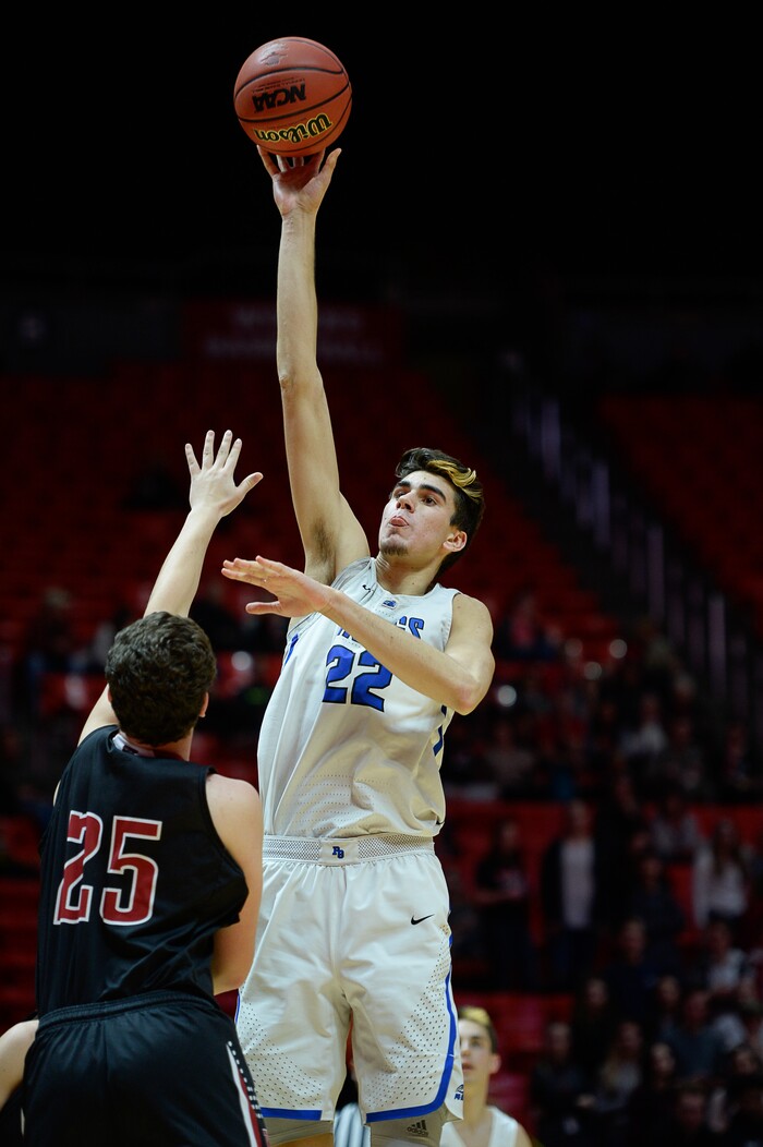 (Francisco Kjolseth  |  The Salt Lake Tribune)  Weber vs Pleasant Grove, 6A State high school basketball tournament at the Huntsman Center in Salt Lake City, Thursday March 1, 2018. Pleasant Grove's Matthew Van Komen (22) towers over Weber. 