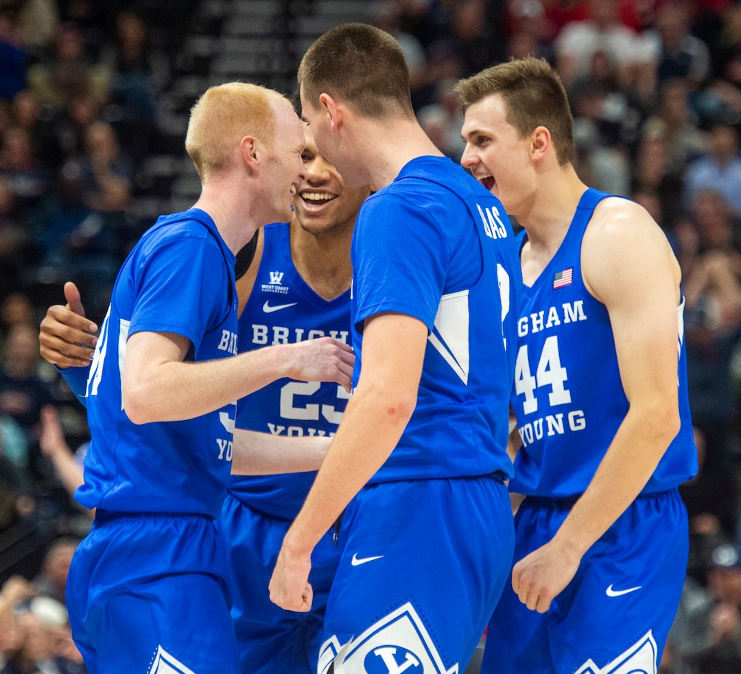 (Rick Egan  |  The Salt Lake Tribune)   Brigham Young Cougars Cougar guard, TJ Haws, draws foul on a 3-point shot, in basketball action in the Beehive Classic, between against the Brigham Young Cougars and Utah Utes, a the Vivint Smart Home Arena, Saturday December 8, 2018.
