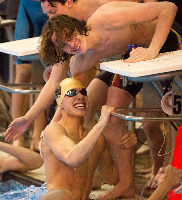 (Rick Egan  |  The Salt Lake Tribune)    Lone Peak Swimmer Jordan Tiffany (top) congratulates Johnnie Condie as they celebrate Lone Peak's state championship win in the 200 Yard Freestyle relay, in 6A State Swimming Championships in Bountiful, Friday, February 9, 2018.