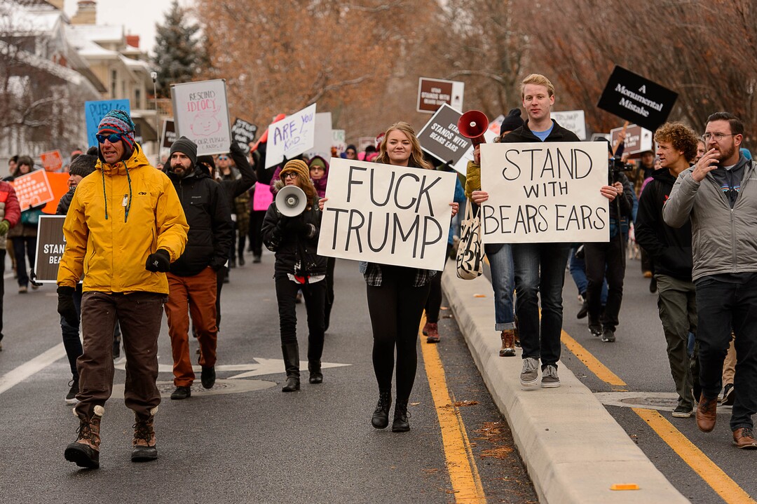 (Trent Nelson | The Salt Lake Tribune)  Protesters march down State Street after a rally against a visit by President Donald Trump, Monday December 4, 2017.