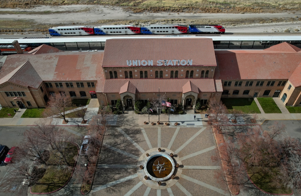 (Francisco Kjolseth | The Salt Lake Tribune) FrontRunner passes Ogden's Union Station, where passenger train service could possibly return, Friday, Nov. 14, 2025.