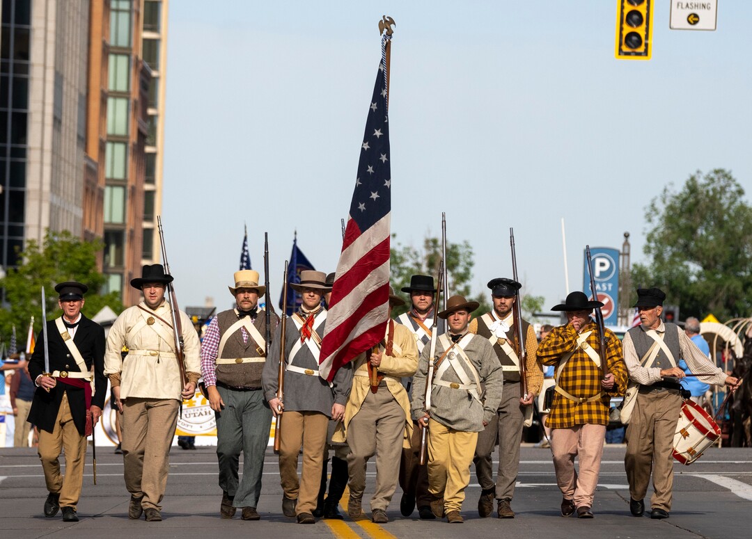 (Rick Egan | The Salt Lake Tribune) a group carrying the American flag leads off the Days of '47 Parade, in Salt Lake City, on Friday, July 23, 2021.