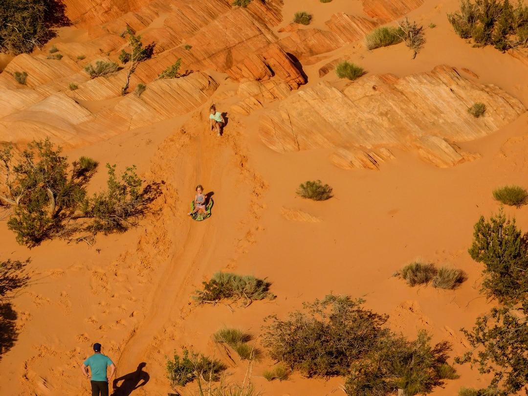 Erin Alberty  |  The Salt Lake TribuneA family sleds down a sandy slope in the Sand Cove campground April 1, 2017 in the Red Cliffs Desert Reserve near Leeds.