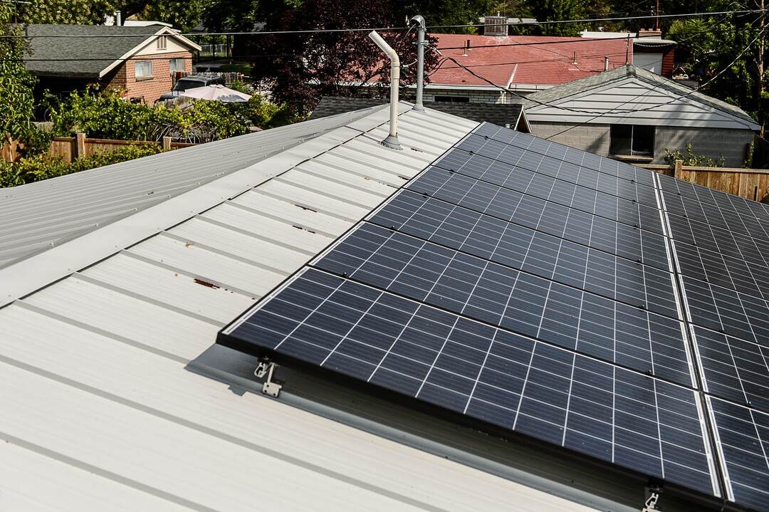 (Trent Nelson  |  The Salt Lake Tribune)  Solar panels on the roof of Erin and Ray Searles's Rose Park home, Friday August 4, 2017. Rocky Mountain Power has proposed a new rate schedule for customers with solar panels. The proposal would disproportionately impact low- and moderate-income households while giving wealthier households a break.