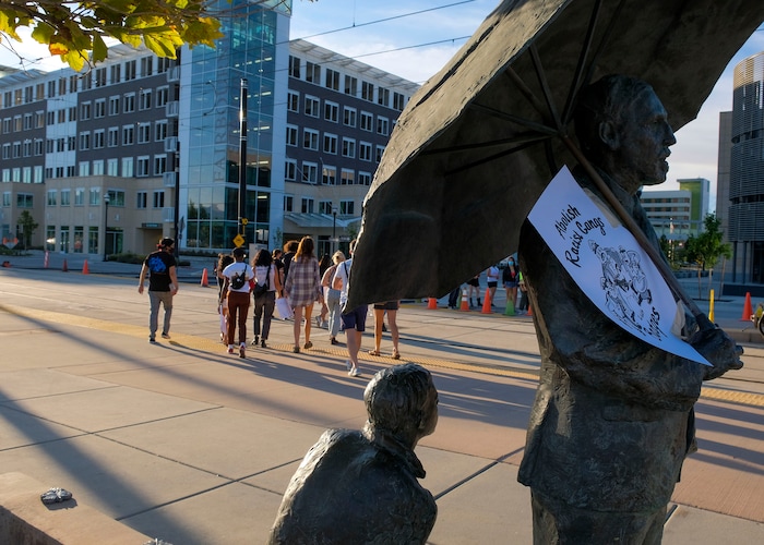 (Leah Hogsten  |  The Salt Lake Tribune) Protesters walk to the West Valley Police Department during the People's Council rally to defund the police force, Aug.8, 2020.  Saturday's rally was hosted by the Salt Lake chapter of the Party for Socialism and Liberation.