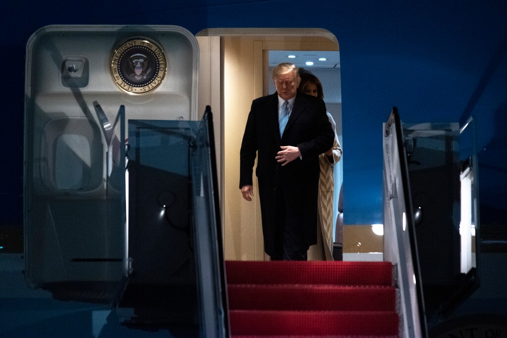 (Kevin Wolf | AP)  President Donald Trump and first lady Melania Trump exit Air Force One, Sunday, Jan. 5, 2020, at Andrews Air Force Base, Md., following a trip to his Mar-a-Lago estate.