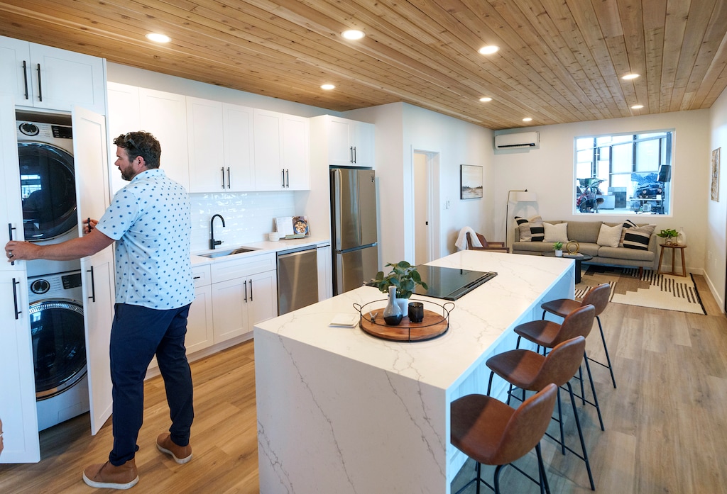 (Leah Hogsten | The Salt Lake Tribune) Stack Homes CEO Sumner Douglas shows off the interior of the company's Ridgeline II, 2 bedroom, 2 bath, 960 square foot model modular home during the Salt Lake Parade of Homes open house at their West Jordan manufacturing plant, Friday, July 28, 2023.