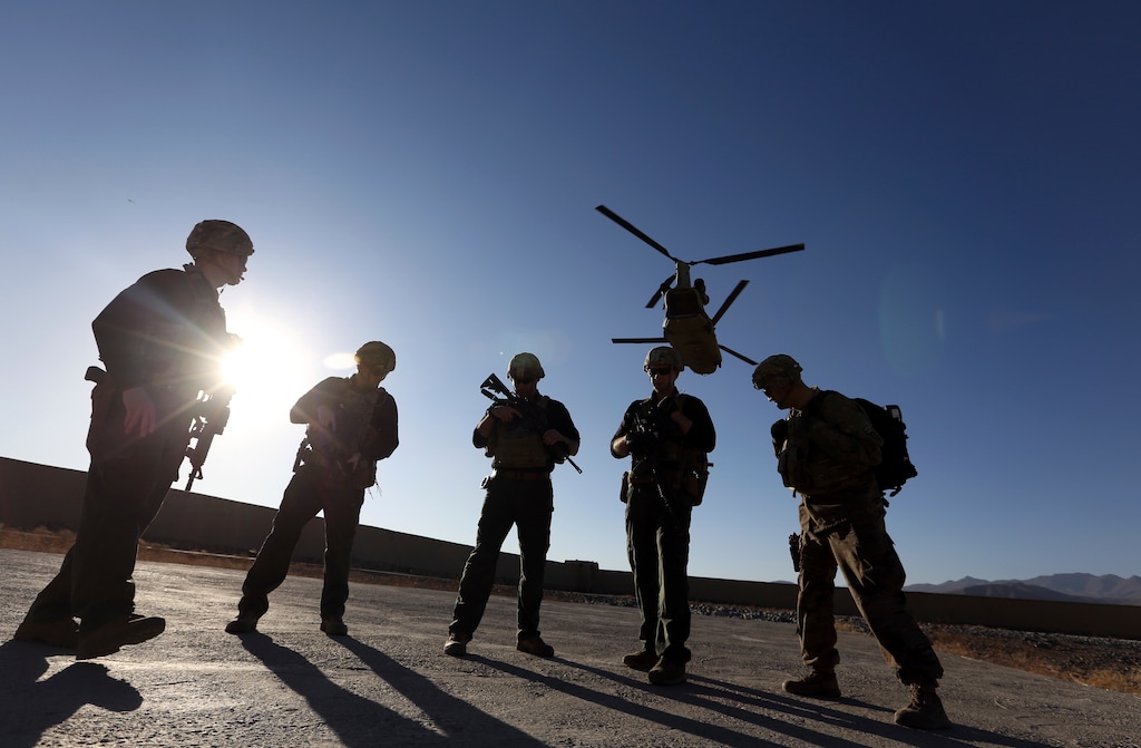 (Rahmat Gul | AP file photo) American soldiers wait on the tarmac in Logar province, Afghanistan, on Nov. 30, 2017. Top officials in the White House were aware in early 2019 of classified intelligence indicating Russia was secretly offering bounties to the Taliban for the deaths of Americans, a full year earlier than has been previously reported.