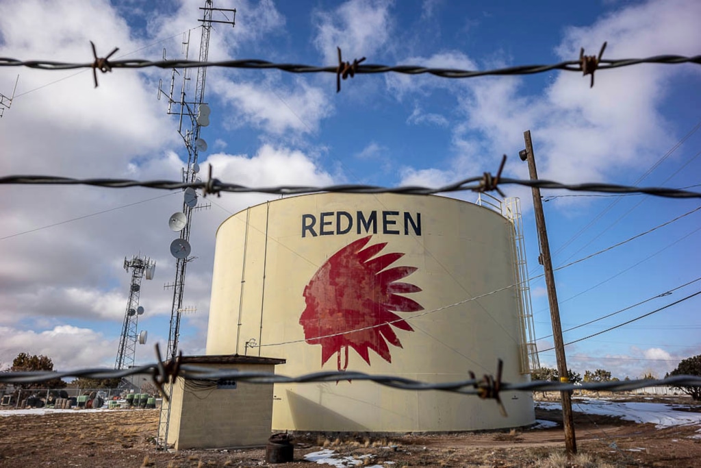 (Trent Nelson | Tribune file photo via AP) On Jan. 11, 2019, a water tank sits above Cedar City, Utah, with the Redmen mascot of Cedar High School displayed on it. The painted image of a Native American and the name "Redmen" remains a city marker in the southern Utah town despite a decision to change the high-school mascot that inspired it. Utah lawmakers are considering a resolution which encourages all Utah public schools to retire their Native American mascots and Indigenous stereotypes.