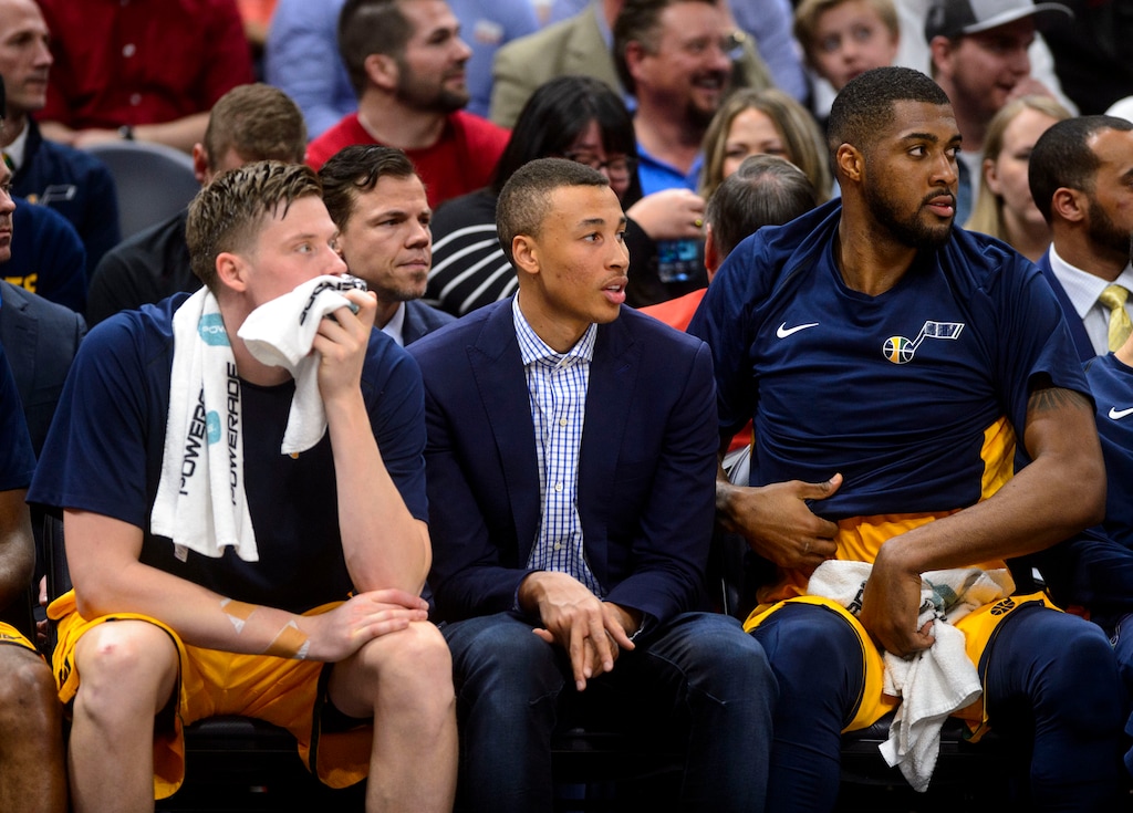 (Steve Griffin  |  The Salt Lake Tribune)  Dante Exum sits with Utah Jazz forwards Jonas Jerebko (8), left, and Derrick Favors (15) during the Utah Jazz versus Detroit Pistons at Vivint Smart Home Arena in Salt Lake City, Tuesday, March 13, 2018.