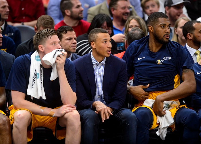 (Steve Griffin  |  The Salt Lake Tribune)  Dante Exum sits with Utah Jazz forward Jonas Jerebko (8), left, and Utah Jazz forward Derrick Favors (15) during the Utah Jazz versus Detroit Pistons at Vivint Smart Home Arena in Salt Lake City Tuesday March 13, 2018.