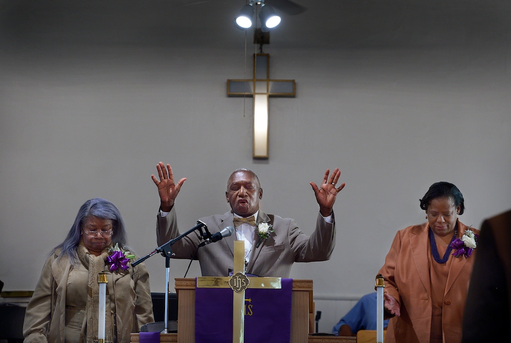 Scott Sommerdorf | The Salt Lake Tribune
Trinity African Methodist Episcopal Church was host to an interdenominational sunrise service Easter Sunday, April 20, 2014. The Rev. France Davis, center, of Calvary Missionary Baptist spoke at the small historic church. The service included members of United Methodist, Episcopal, and Calvary Baptist. To the left is Rev. Nurjhan B. Govan of Trinity, and at right is Vinnetta Golphin-Wilkerson, Pastor at Granger Community Church in West Valley City.