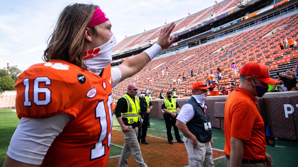 Clemson quarterback Trevor Lawrence (16) waves to fans after an NCAA college football game against Syracuse in Clemson, S.C., on Saturday, Oct. 24, 2020. (Ken Ruinard/Pool Photo via AP)
