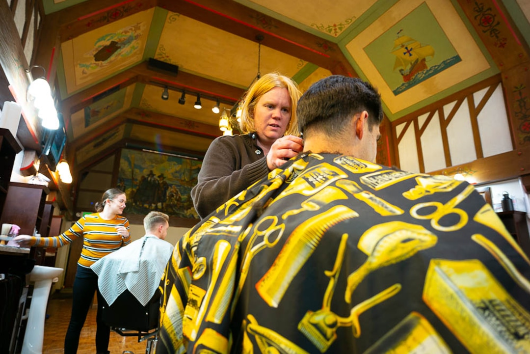(Trent Nelson | The Salt Lake Tribune)  
Joy Farias styles Michael Escalante's hair at Ray's Barber Shop in Salt Lake City on Thursday Feb. 28, 2019.