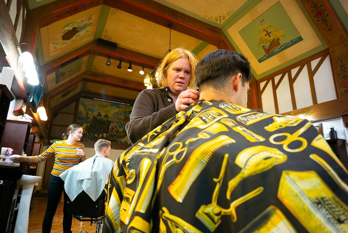(Trent Nelson | The Salt Lake Tribune)
Joy Farias styles Michael Escalante's hair at Ray's Barber Shop in Salt Lake City on Thursday Feb. 28, 2019.