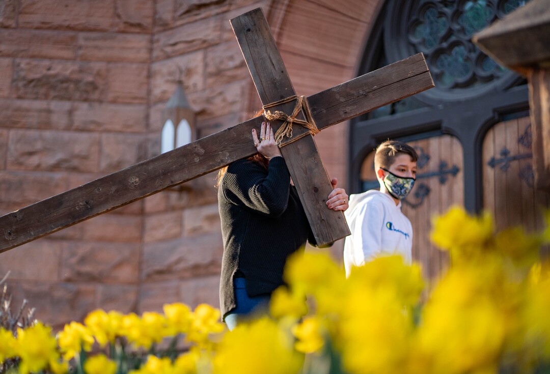 (Francisco Kjolseth  | The Salt Lake Tribune) Mask wearing Utah Christians walk the streets of Salt Lake City beginning at Cathedral of the Madeleine on Good Friday, to symbolically mark Jesus' carrying the cross to his crucifixion, April 2, 2021.