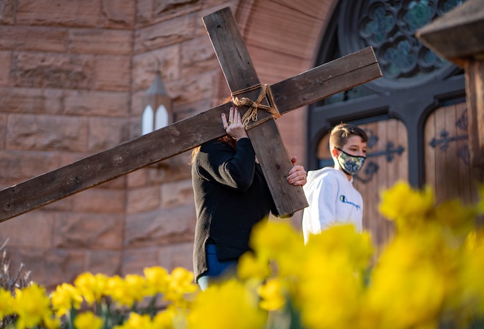 (Francisco Kjolseth | The Salt Lake Tribune) Mask wearing Utah Christians walk the streets of Salt Lake City beginning at Cathedral of the Madeleine on Good Friday, to symbolically mark Jesus' carrying the cross to his crucifixion, April 2, 2021.