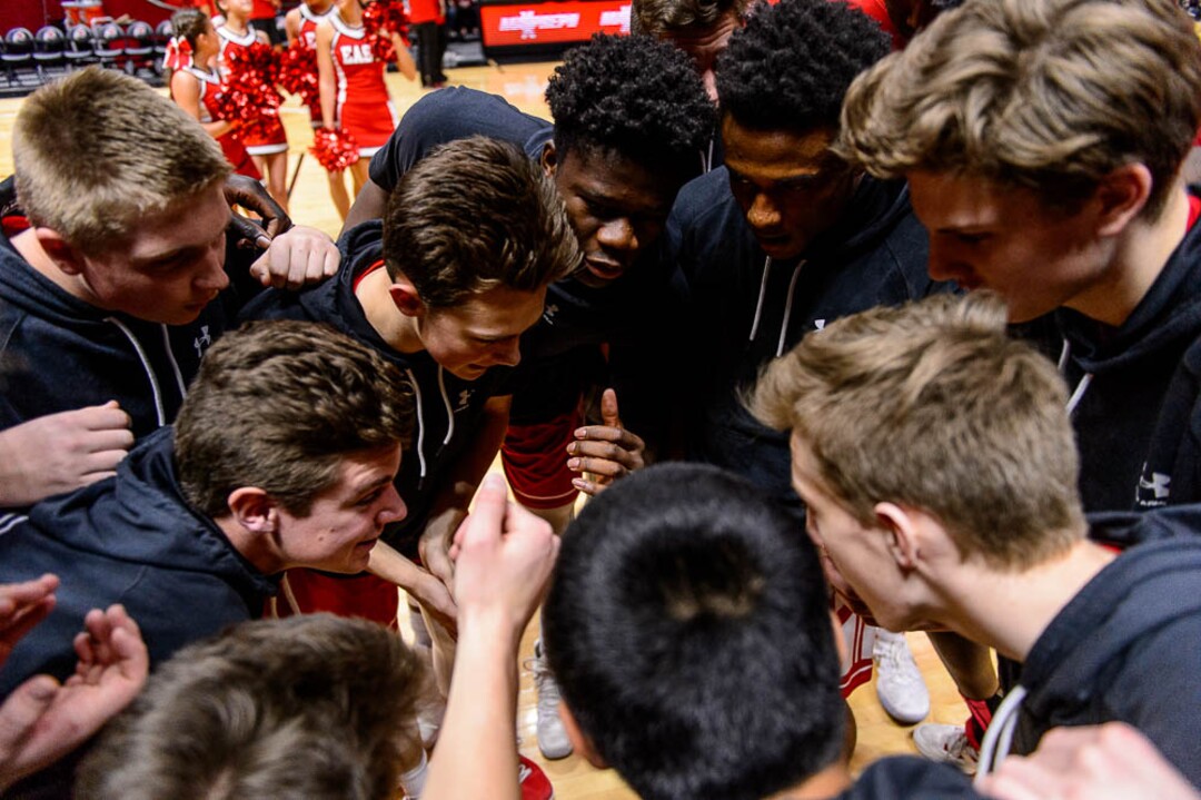 (Trent Nelson | The Salt Lake Tribune)  East vs. Timpanogos, 5A State high school basketball tournament at the Huntsman Center in Salt Lake City, Wednesday Feb. 28, 2018. East players huddle pre-game.